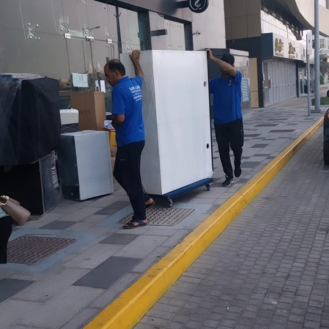 Office relocation crew moving workstations in Abu Dhabi